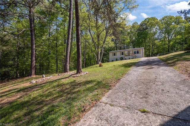 120 King Charles Rd, Hillsborough, NC 27278 - view of front of property featuring a forest view, a front lawn, aphalt driveway, and fence