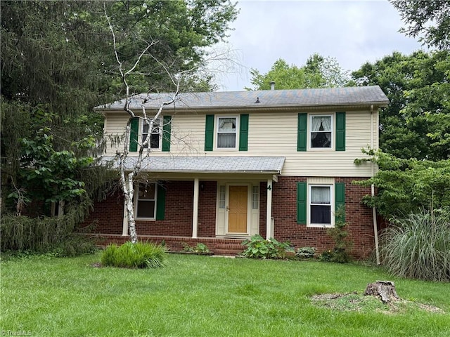 4 Frostbrook Ct, Greensboro, NC 27455 - traditional-style home featuring a front yard, brick siding, and covered porch