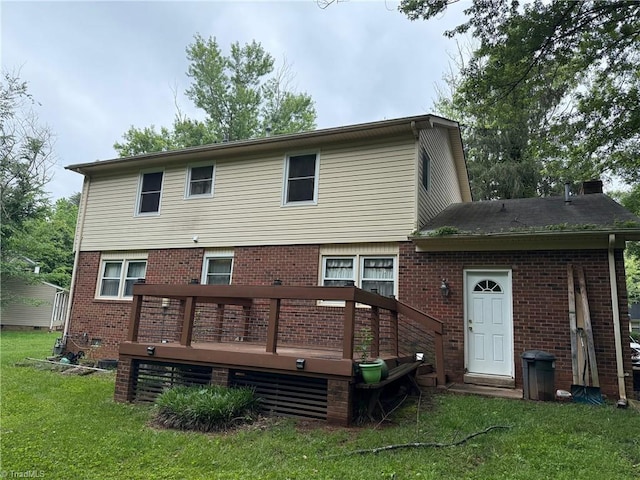 4 Frostbrook Ct, Greensboro, NC 27455 - back of house with brick siding, a wooden deck, and a yard