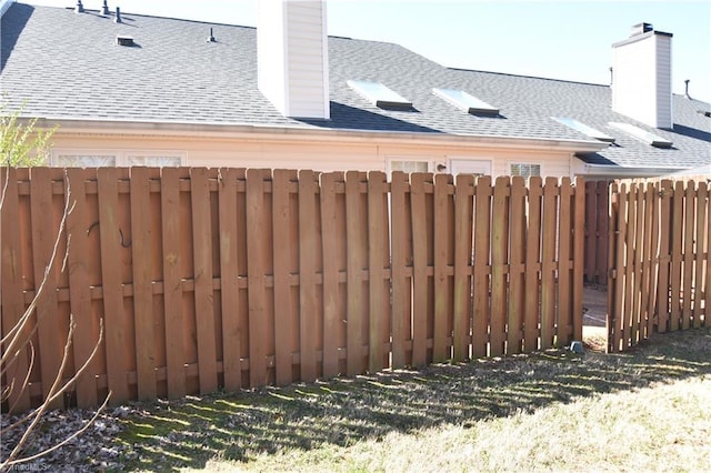 view of gate featuring fence