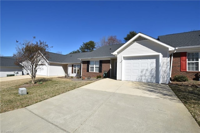 single story home with concrete driveway, brick siding, and an attached garage