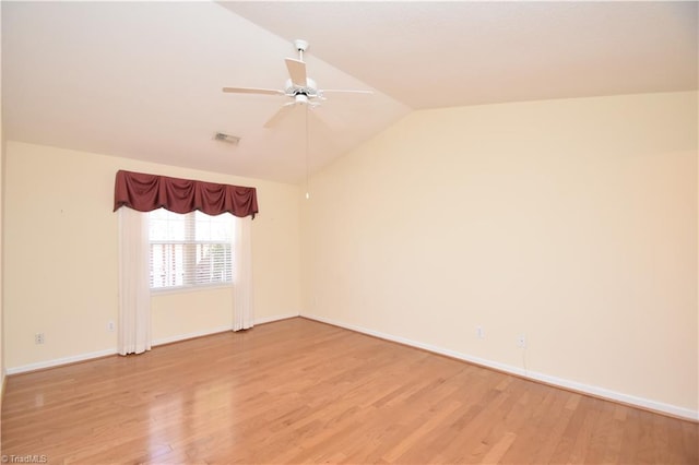 unfurnished room featuring visible vents, baseboards, ceiling fan, light wood-style flooring, and vaulted ceiling