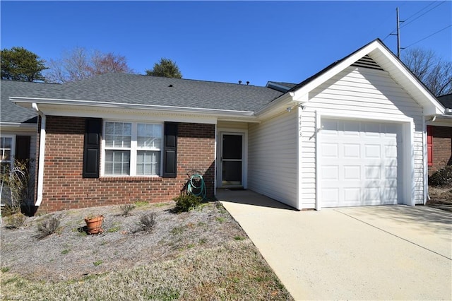 ranch-style house with a garage, driveway, a shingled roof, and brick siding