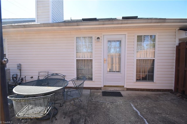 property entrance featuring a patio area