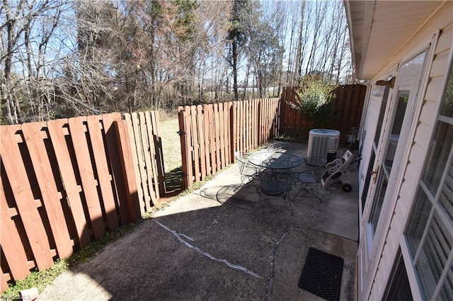 view of patio / terrace with a fenced backyard and cooling unit