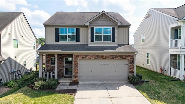 craftsman inspired home featuring a front lawn, driveway, board and batten siding, covered porch, and a garage