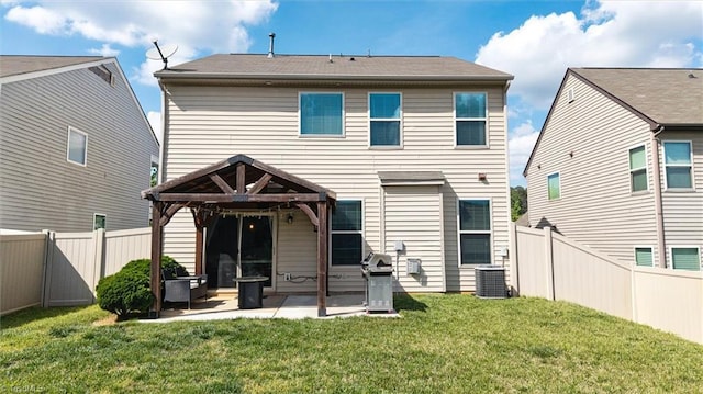 back of property featuring a lawn, a patio area, a fenced backyard, and central AC