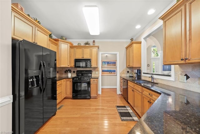 kitchen featuring tasteful backsplash, black appliances, sink, crown molding, and light hardwood / wood-style flooring