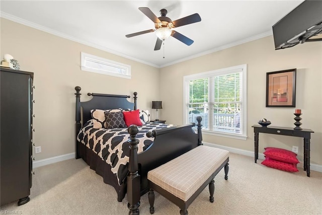 carpeted bedroom with ceiling fan and ornamental molding