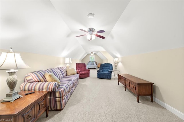 living room featuring light carpet, ceiling fan, and vaulted ceiling