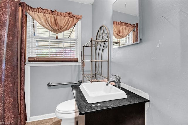904 Ashe St, Greensboro, NC 27406 - bathroom featuring vanity, healthy amount of natural light, and tile patterned flooring