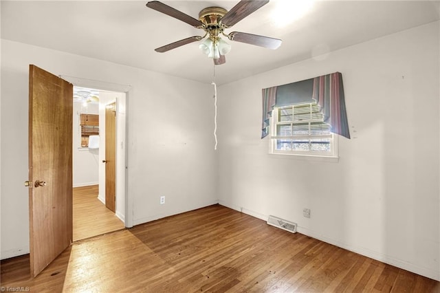 904 Ashe St, Greensboro, NC 27406 - spare room featuring wood finished floors and ceiling fan