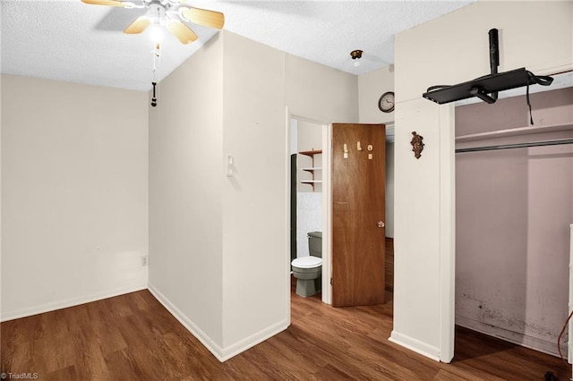 904 Ashe St, Greensboro, NC 27406 - unfurnished bedroom featuring wood finished floors, a closet, a textured ceiling, and a ceiling fan