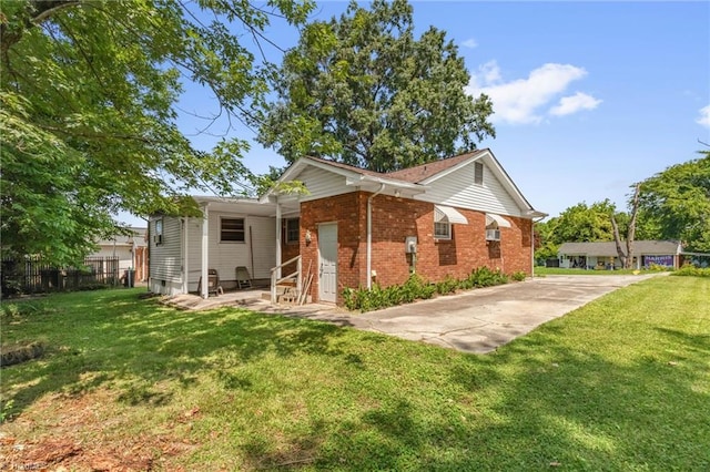 904 Ashe St, Greensboro, NC 27406 - back of house with brick siding, entry steps, and driveway