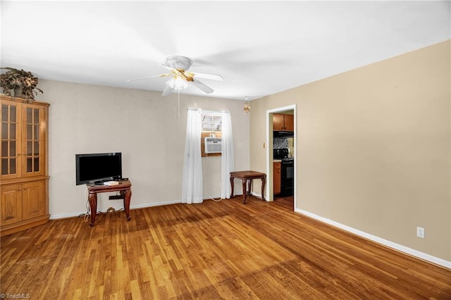 904 Ashe St, Greensboro, NC 27406 - living room featuring light wood-type flooring and a ceiling fan