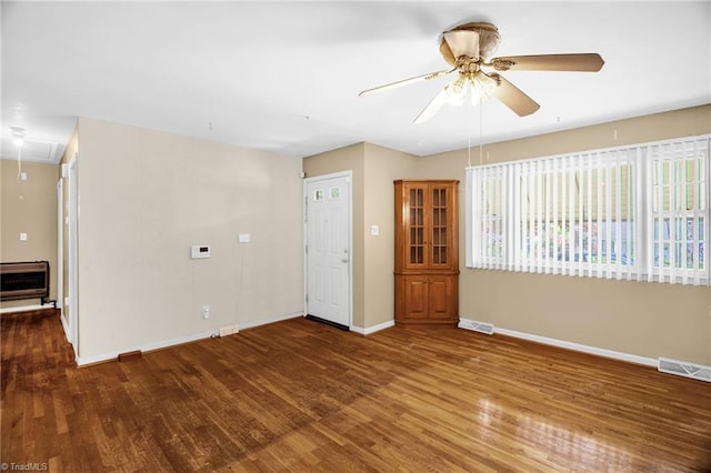 904 Ashe St, Greensboro, NC 27406 - unfurnished room featuring attic access, a ceiling fan, wood finished floors, and heating unit
