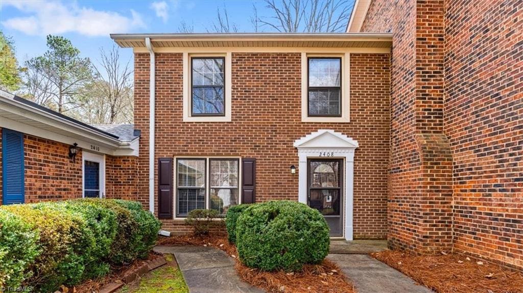 exterior space with brick siding