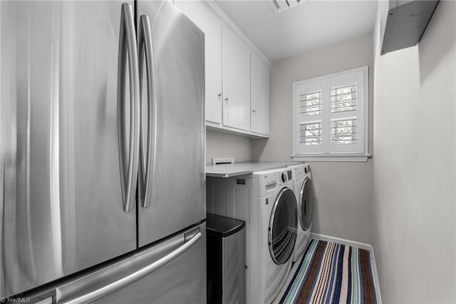 1603 Ilchester Ct, Greensboro, NC 27408 - laundry room with cabinet space and independent washer and dryer