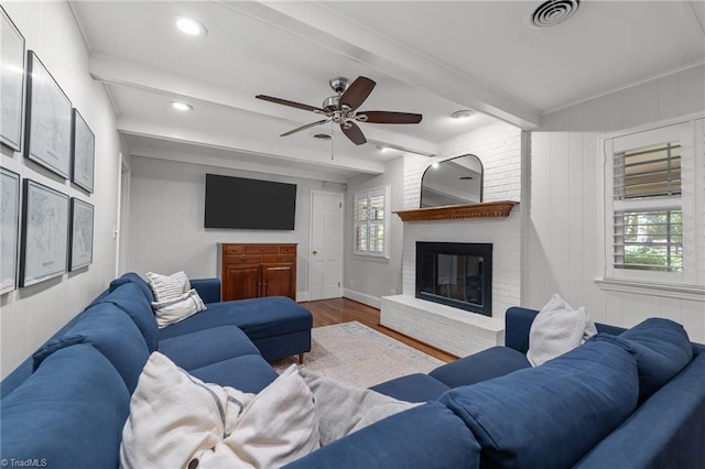 1603 Ilchester Ct, Greensboro, NC 27408 - living room featuring wood finished floors, a fireplace, ceiling fan, beamed ceiling, and recessed lighting