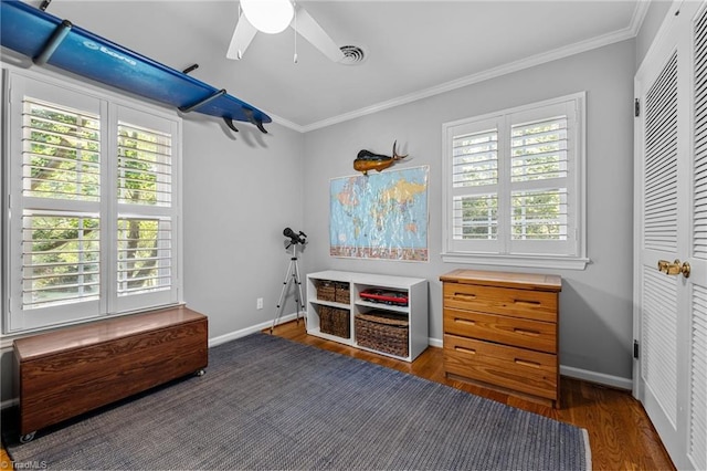 1603 Ilchester Ct, Greensboro, NC 27408 - bedroom with wood finished floors, multiple windows, ornamental molding, ceiling fan, and a closet