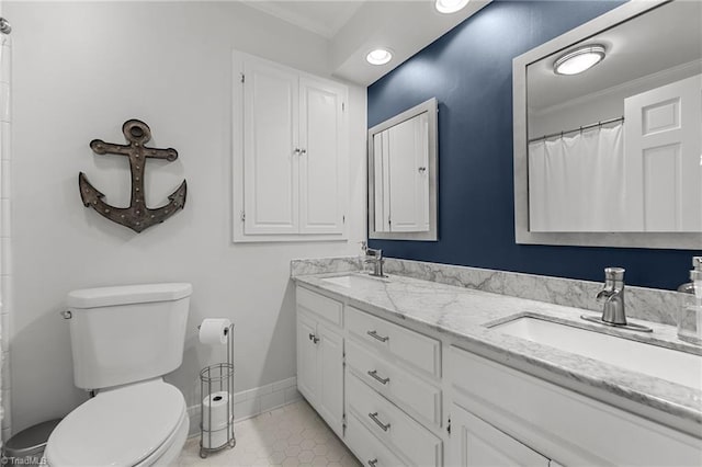 1603 Ilchester Ct, Greensboro, NC 27408 - bathroom featuring double vanity, ornamental molding, tile patterned floors, recessed lighting, and a shower with shower curtain