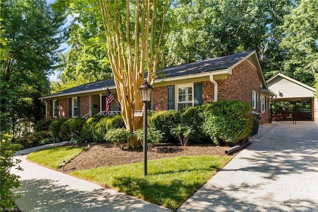 1603 Ilchester Ct, Greensboro, NC 27408 - view of front of property with brick siding, concrete driveway, and covered porch