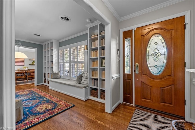 1603 Ilchester Ct, Greensboro, NC 27408 - foyer featuring wood finished floors and crown molding