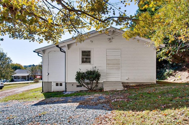 view of side of property featuring entry steps