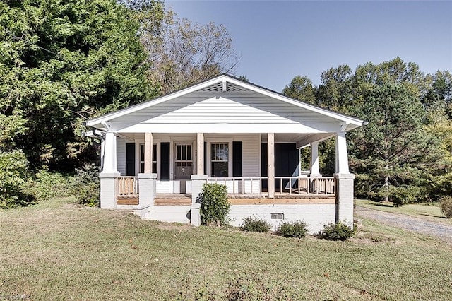 view of front of property with crawl space, a porch, and a front lawn