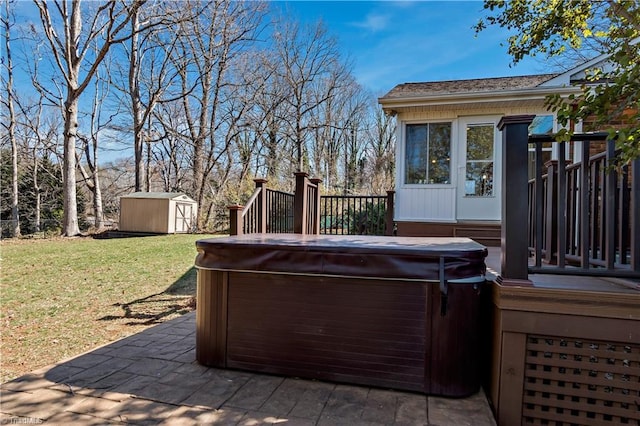 wooden terrace featuring an outbuilding, a yard, a hot tub, and a shed