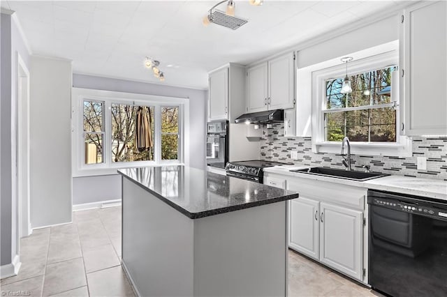 kitchen featuring a center island, range hood, tasteful backsplash, a sink, and black appliances