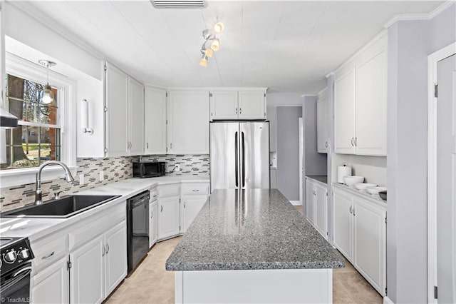 kitchen featuring a kitchen island, white cabinets, a sink, and black appliances