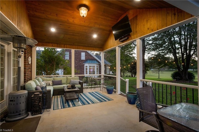 sunroom with wood ceiling and vaulted ceiling