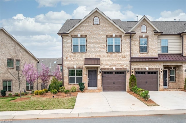 914 Bonanza Ln, Mebane, NC 27302 - view of front of property featuring brick siding, driveway, and a standing seam roof