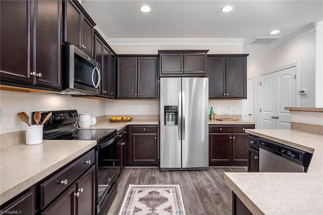 914 Bonanza Ln, Mebane, NC 27302 - kitchen with visible vents, appliances with stainless steel finishes, crown molding, light countertops, and dark wood-style flooring
