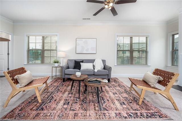 914 Bonanza Ln, Mebane, NC 27302 - living room featuring crown molding, a ceiling fan, baseboards, and visible vents