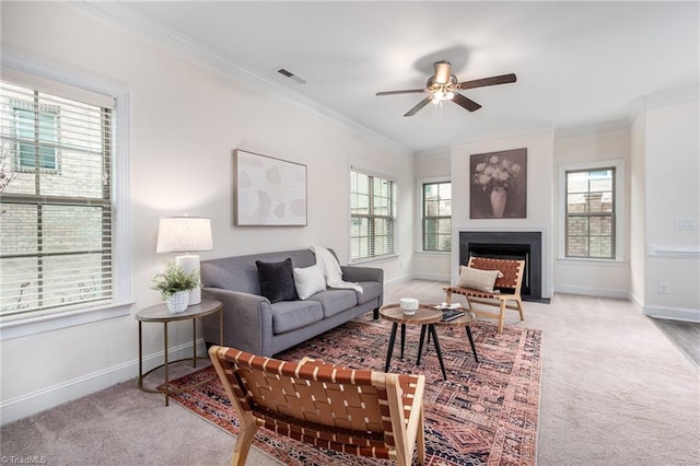 914 Bonanza Ln, Mebane, NC 27302 - carpeted living room with visible vents, crown molding, baseboards, ceiling fan, and a fireplace with flush hearth