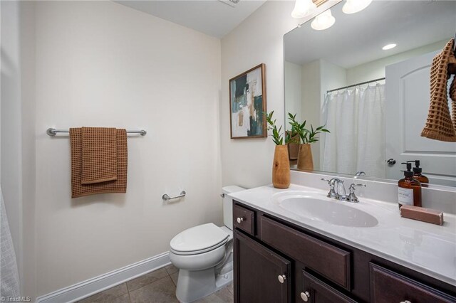 914 Bonanza Ln, Mebane, NC 27302 - full bath featuring baseboards, toilet, vanity, and tile patterned flooring