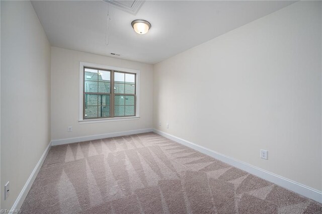 914 Bonanza Ln, Mebane, NC 27302 - unfurnished room with visible vents, attic access, baseboards, and carpet floors