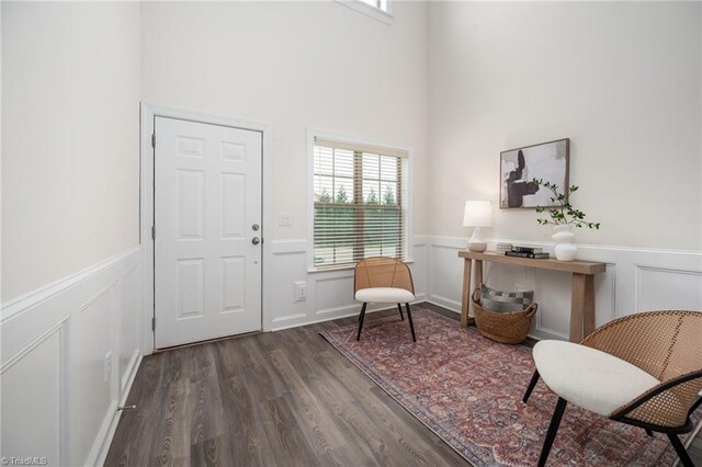 914 Bonanza Ln, Mebane, NC 27302 - entryway featuring dark wood-style floors, wainscoting, and a decorative wall