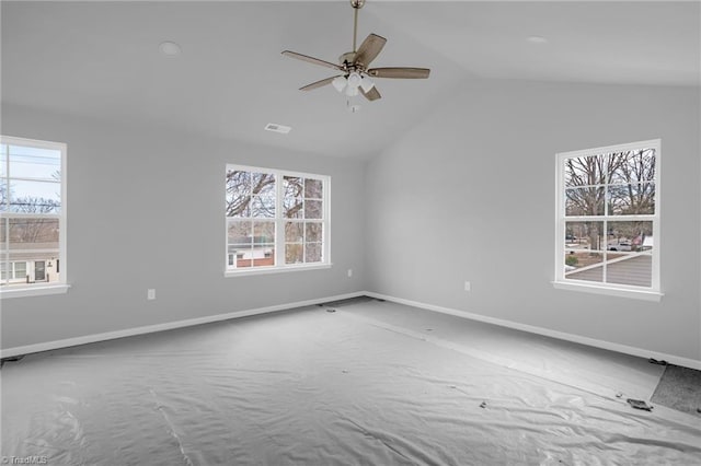 unfurnished room featuring ceiling fan and vaulted ceiling