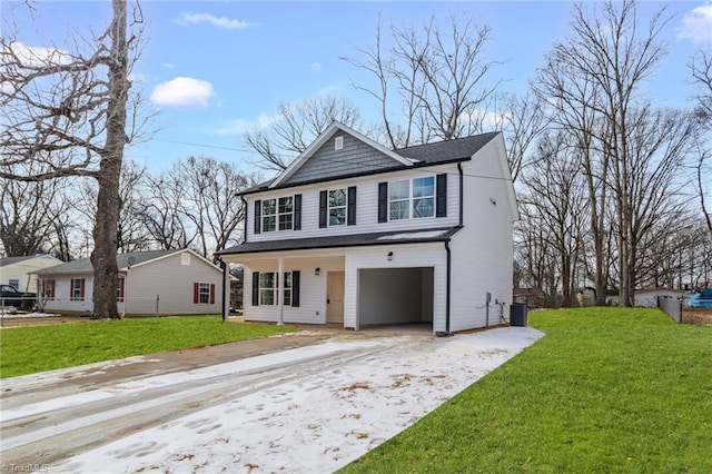 front of property with central AC unit, a front lawn, and a garage