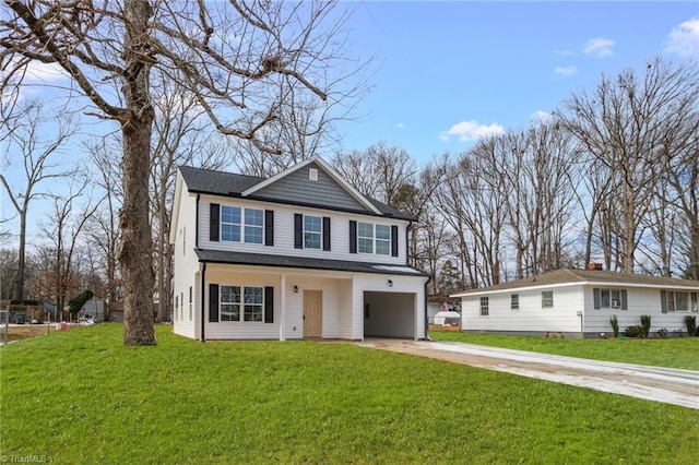 view of property with a front lawn and a garage