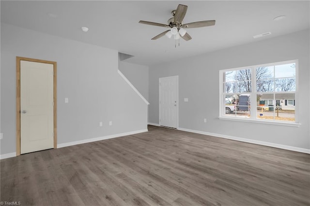 unfurnished living room with ceiling fan and wood-type flooring