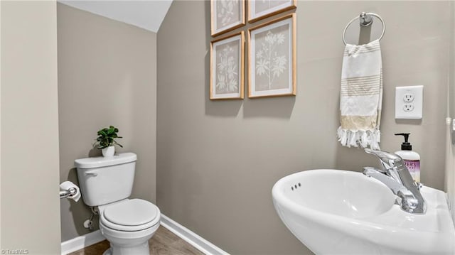 bathroom with toilet and sink