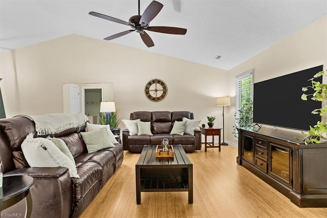 6796 Ironwood Cir, Greensboro, NC 27410 - living area featuring vaulted ceiling, light wood finished floors, and a ceiling fan