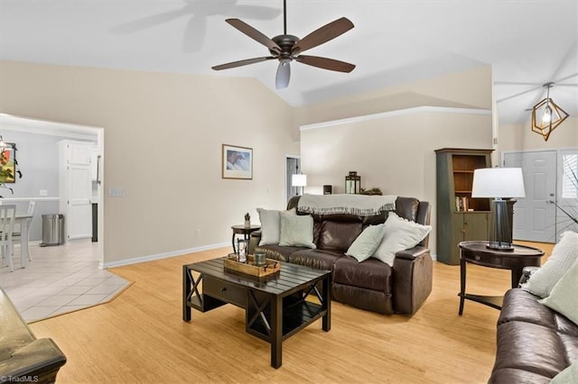 6796 Ironwood Cir, Greensboro, NC 27410 - living room featuring vaulted ceiling, a ceiling fan, light wood-style floors, and baseboards
