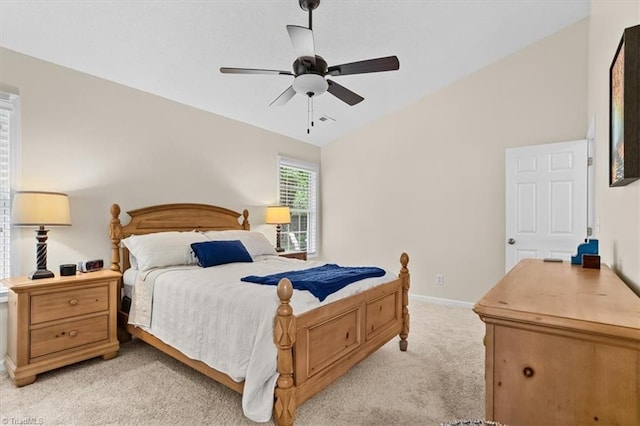 6796 Ironwood Cir, Greensboro, NC 27410 - bedroom with light carpet, vaulted ceiling, baseboards, and a ceiling fan