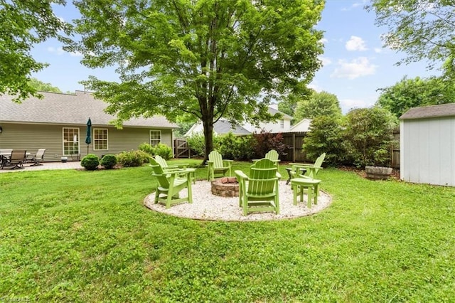 6796 Ironwood Cir, Greensboro, NC 27410 - view of yard featuring an outdoor fire pit and a patio area