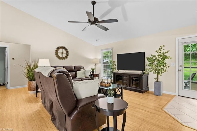 6796 Ironwood Cir, Greensboro, NC 27410 - living room with vaulted ceiling, light wood finished floors, a ceiling fan, and baseboards